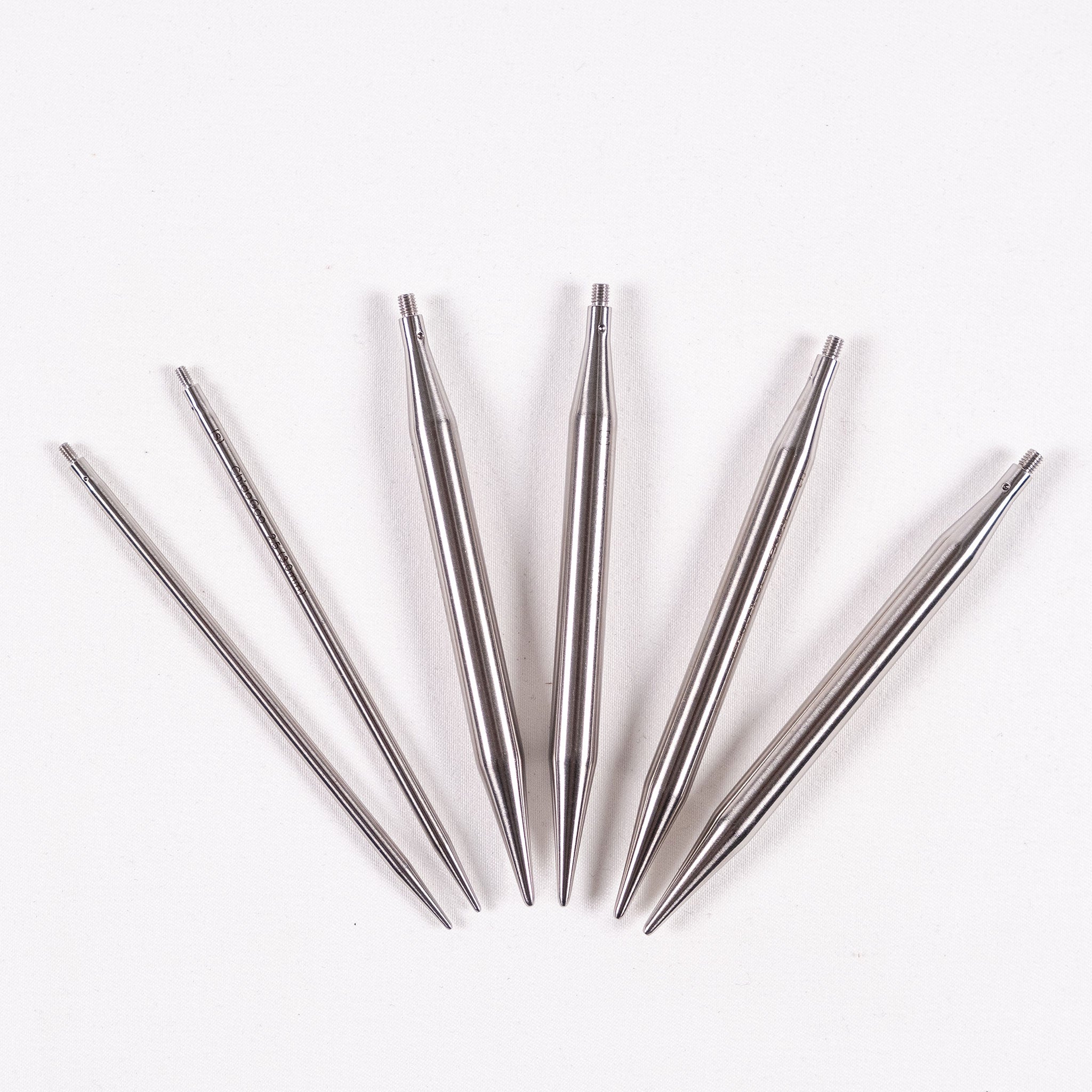 Three pairs of ChiaoGoo 4in long stainless steel interchangeable knitting needle tips in sizes 3mm, 7mm and 7.5mm on a white background