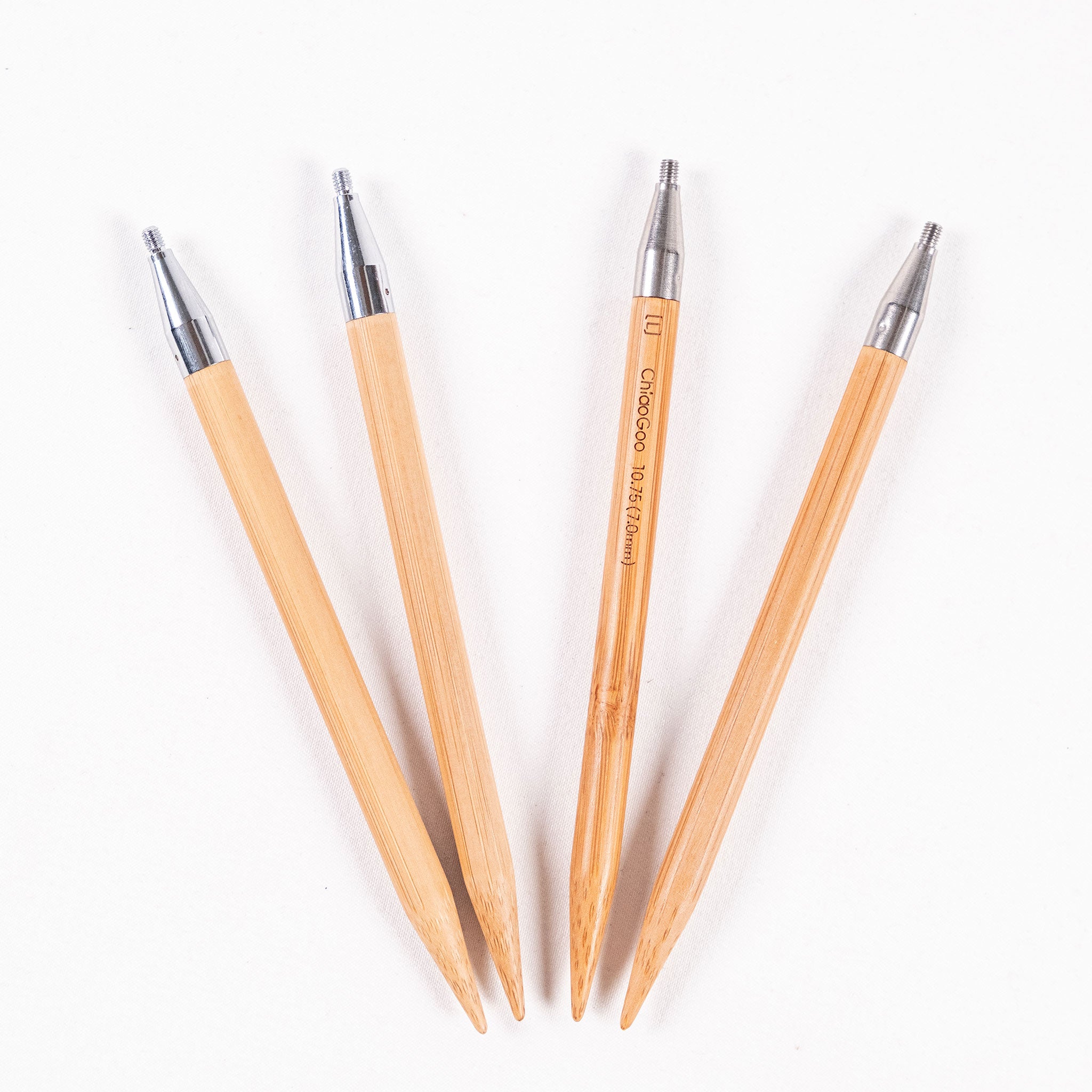 Two pairs of ChiaoGoo SPIN 5in long bamboo tips in sizes 7mm and 7.5mm on a white background