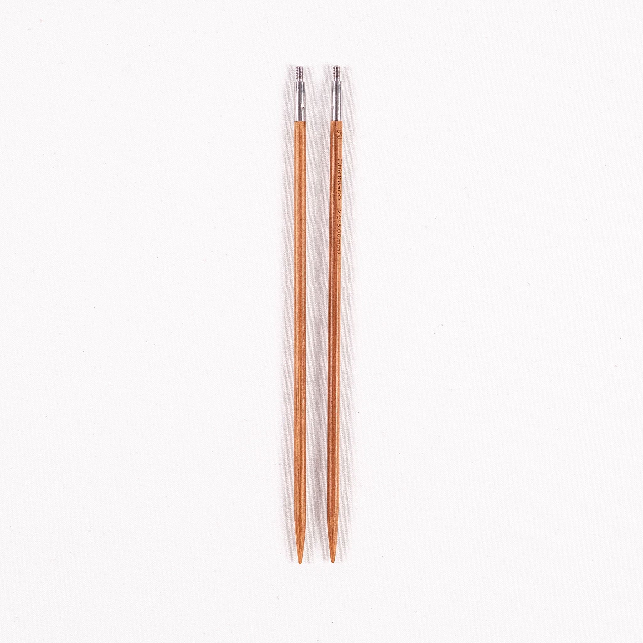 A pair of ChiaoGoo 5in long SPIN bamboo interchangeable knitting needle tips in size 3mm on a white background