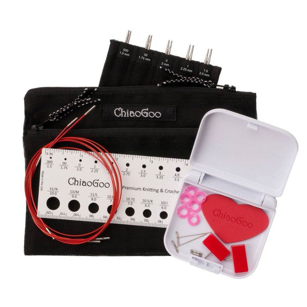 ChiaoGoo 5in Mini set showing labelled tip sleeve with screw ends of tips showing, three red lace cables curled together in a circle, a white plastic ruler needle gauge and Mini Tools Kit - white plastic click shut container with accessories displayed