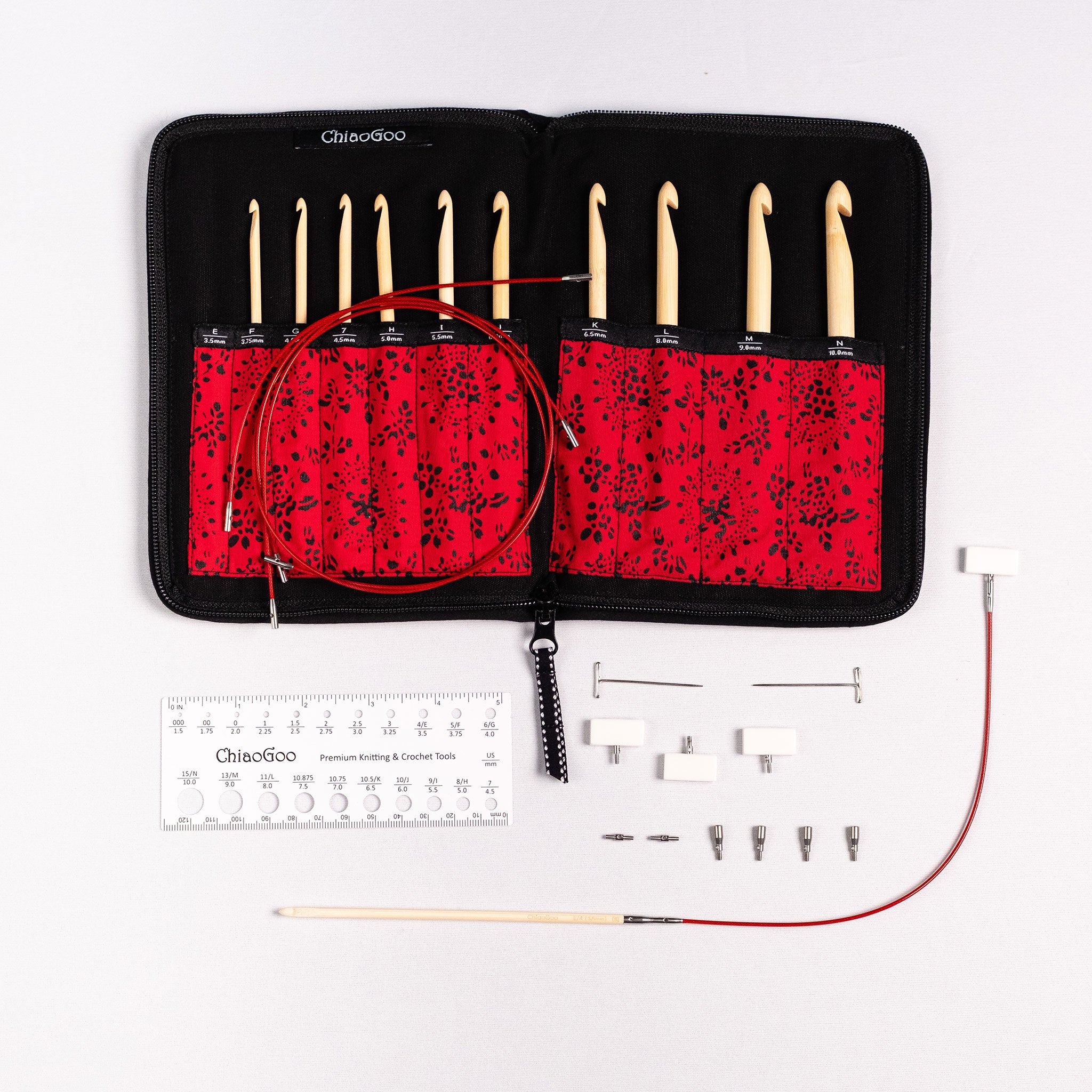 Lay flat of red and black patterned ChiaoGoo T-SPIN interchangeable crochet hook case showing 10 tips inside labelled pockets and one hook connected to TWIST red lace cable with white end stopper connected at opposite end