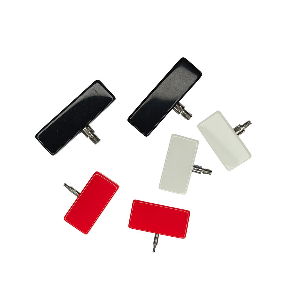 Three pairs of ChiaoGoo cable end stoppers, resin rectangles with male screw threads, black (large), red (mini) and white (small)