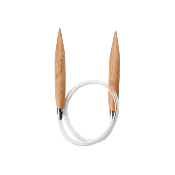A ChiaoGoo extra large wooden circular knitting needle with clear nylon cable on a white background