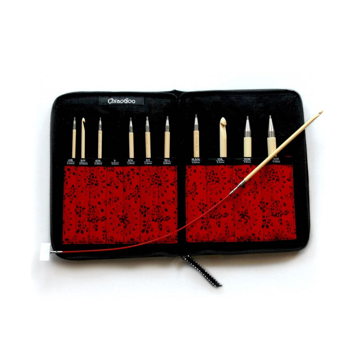 Lay flat of red and black patterned ChiaoGoo T-SPIN interchangeable crochet hook case showing 10 tips inside labelled pockets and one hook connected to TWIST red lace cable with white end stopper connected at opposite end