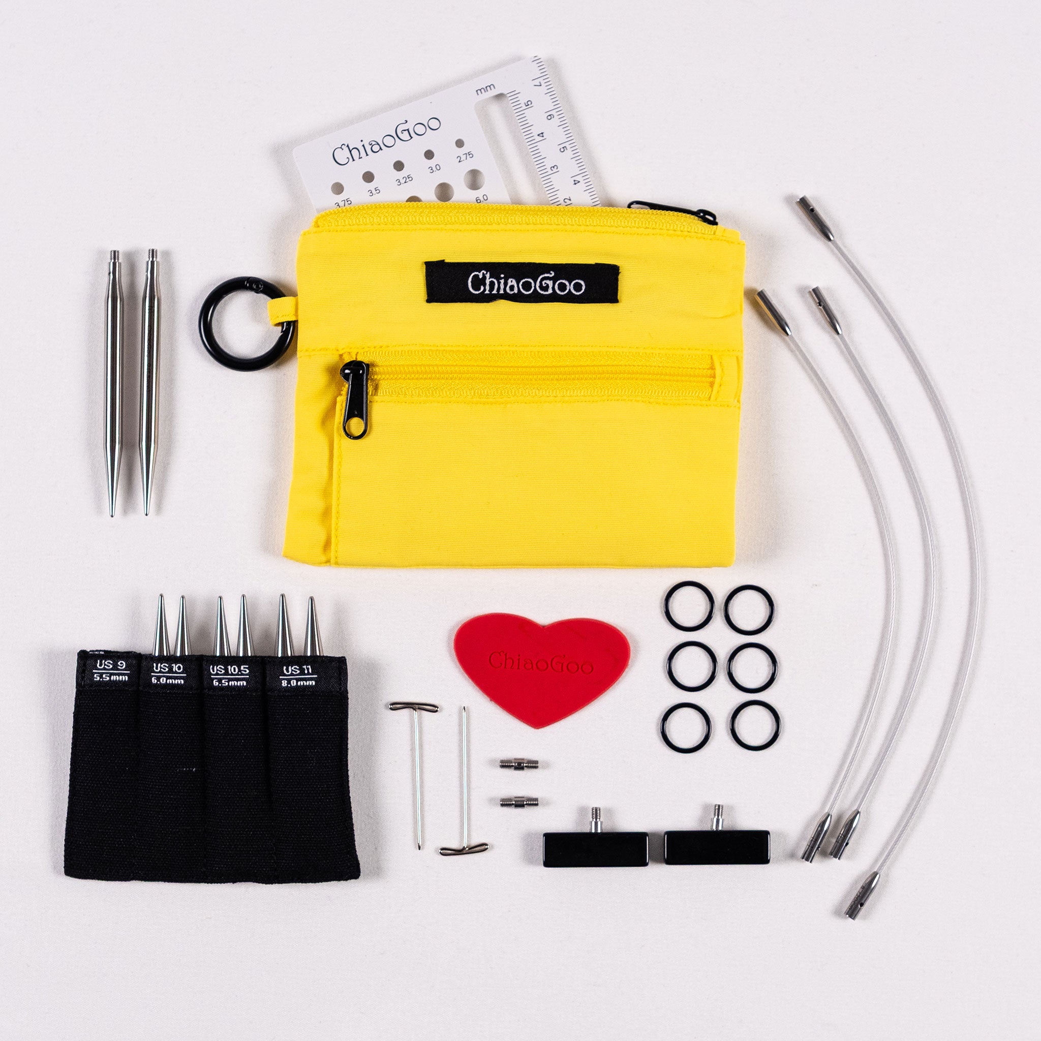 ChiaoGoo Yellow Shorties set showing black labelled tip pocket with 3in tips, yellow nylon zippered pouch , 5in 6in 8in silver coloured SWIV360 cables, red heart, large end stoppers, six black stitch markers, two tightening keys, two large cable connectors, 3in square swatch needle gauge
