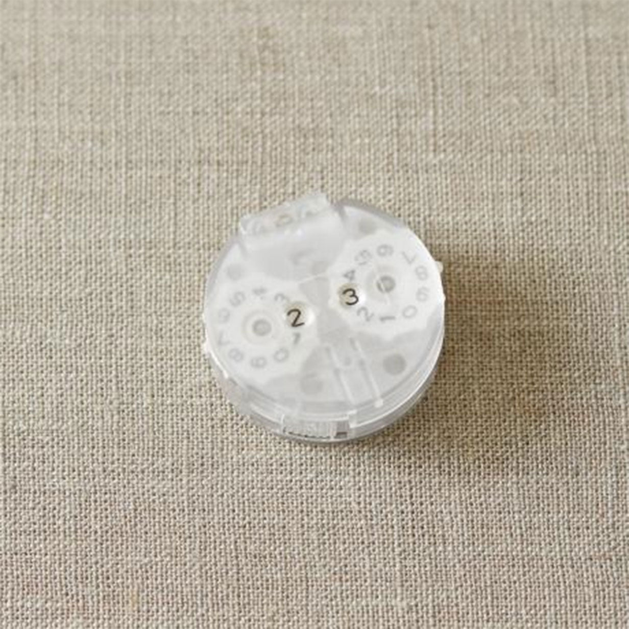 Round row counter with translucent plastic face