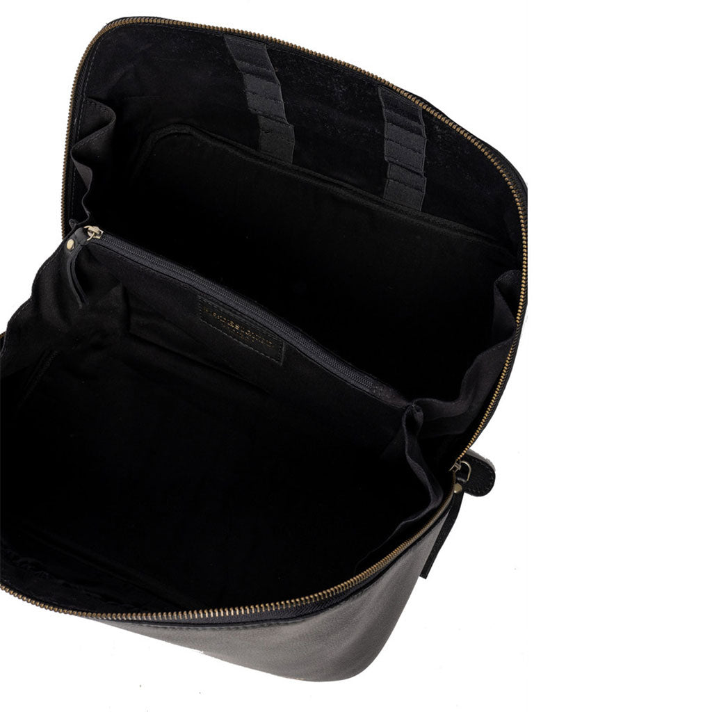 Interior of black leather knitting project bag, brass zip, central dividing pocket with zip