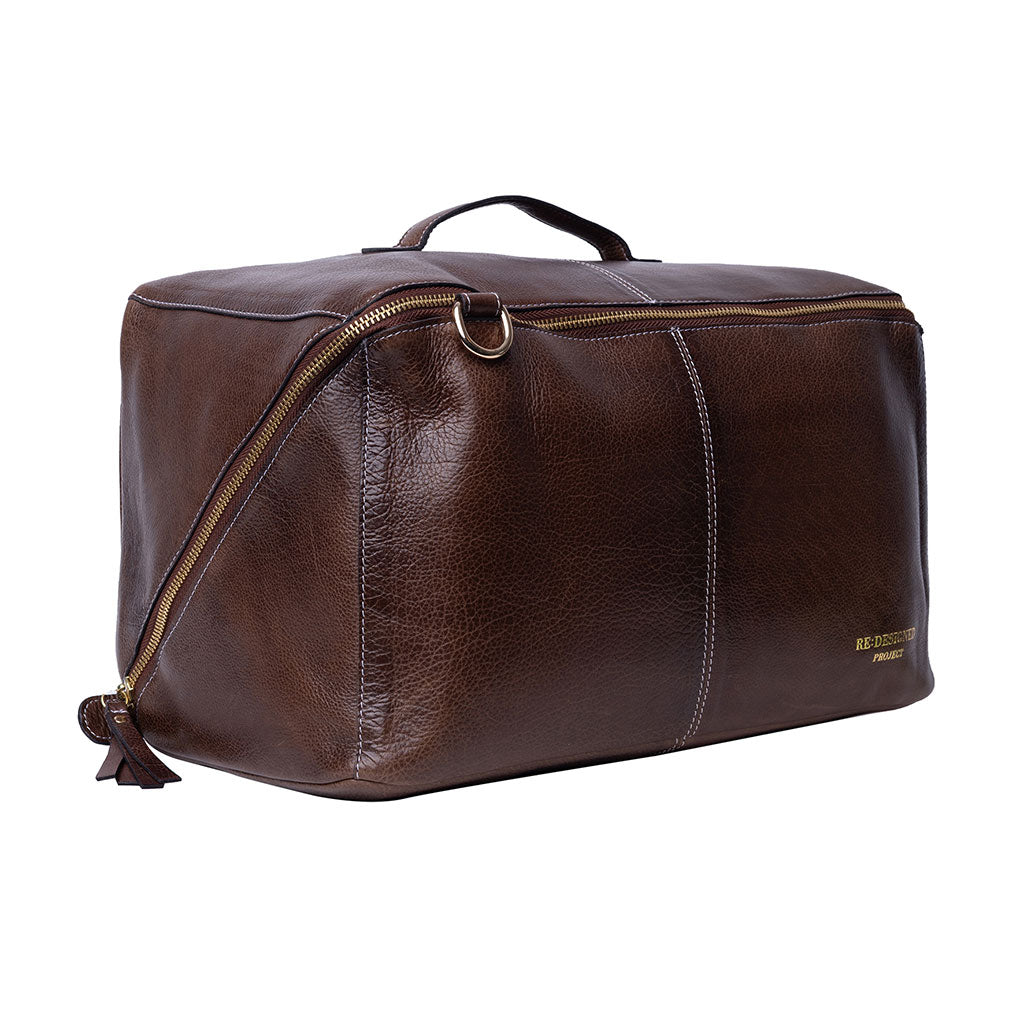 Side view of woodsmoke brown leather XL organiser project bag with gold zipper on a white background