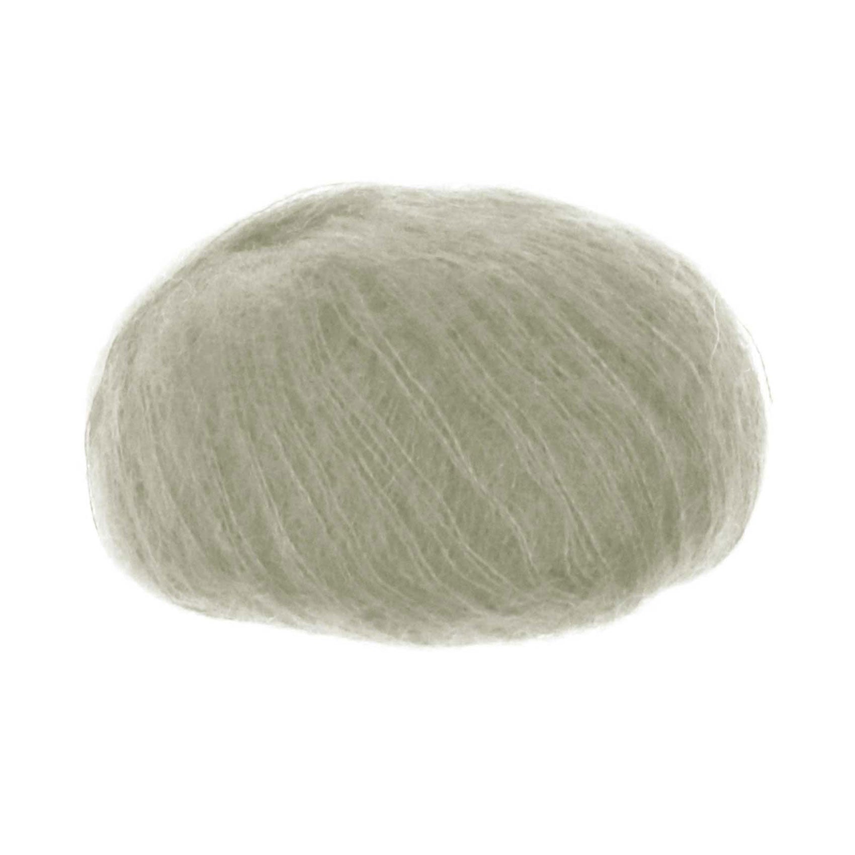 A ball of silk and superfine kid mohair yarn in light sage colour