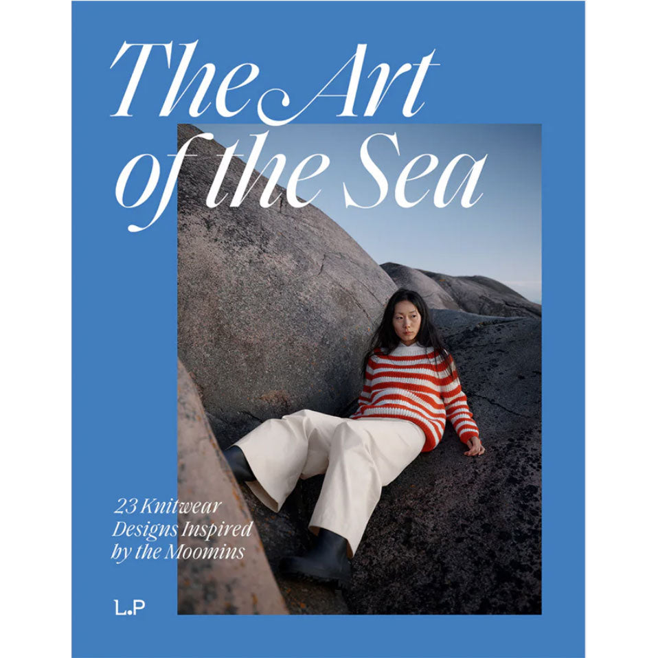 Book cover of 'The Art of the Sea' with a person sitting on rocks.