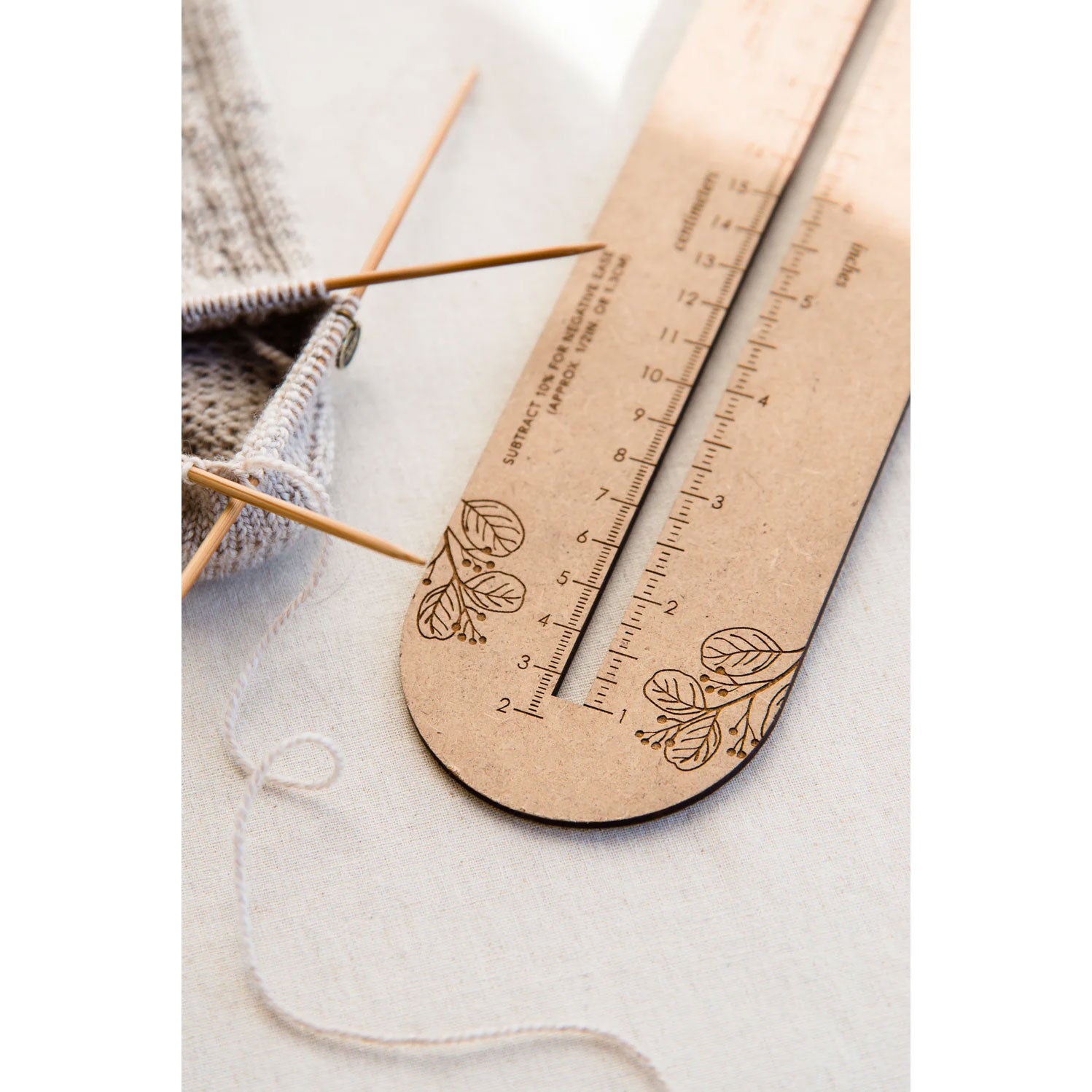 Sock knitting ruler centre slot at heel area
