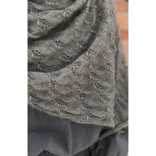 Windy Fields by Marjut Lund-Rahkola. Close-up of a textured gray knitted fabric with a puffy wheat ear pattern