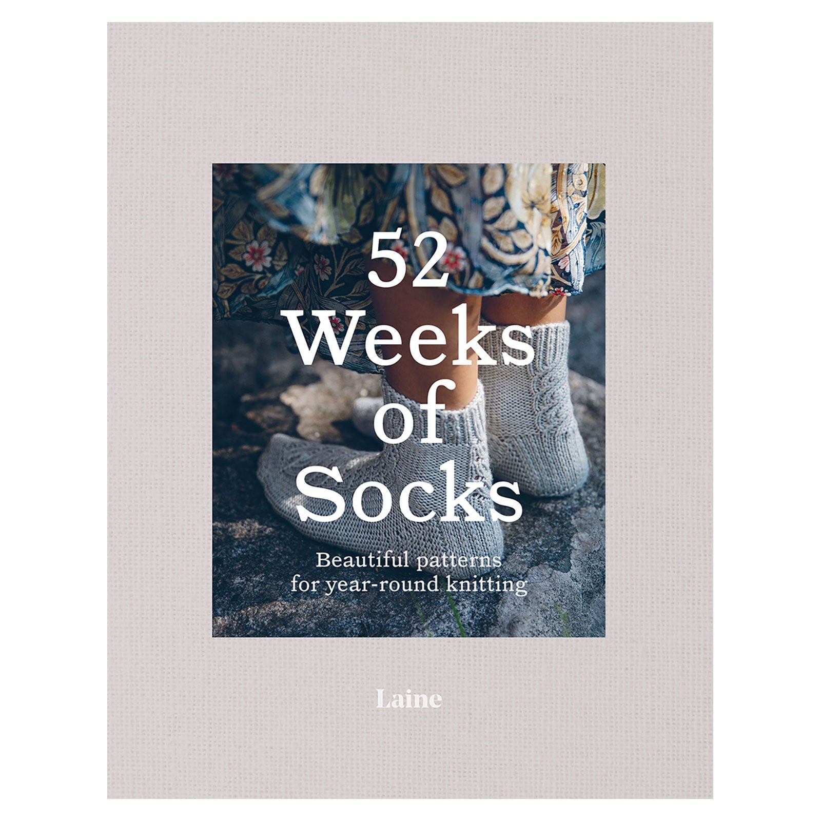 Book cover of '52 Weeks of Socks' by Laine on a textured beige background