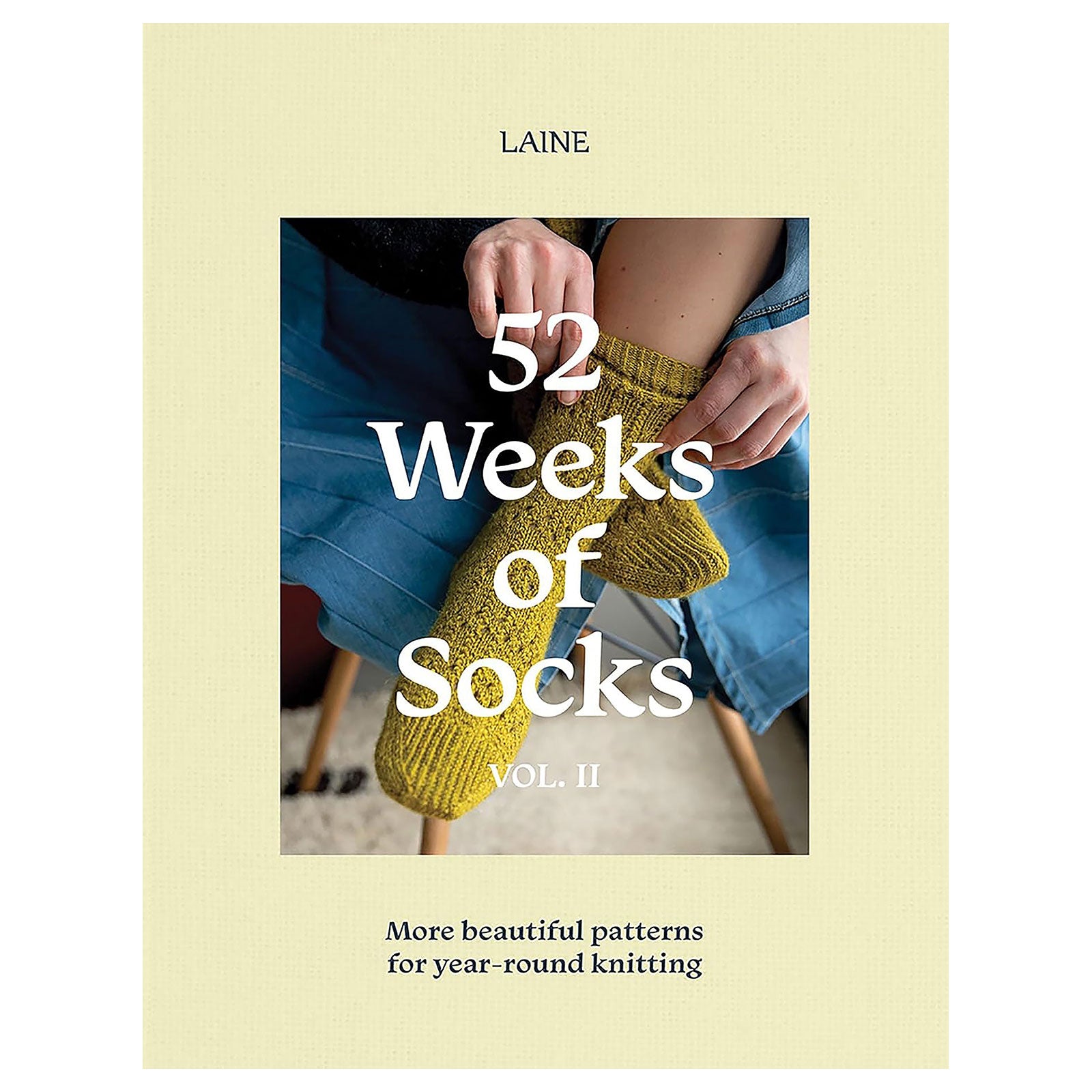Book cover of '52 Weeks of Socks Vol. II' by Laine on a beige background