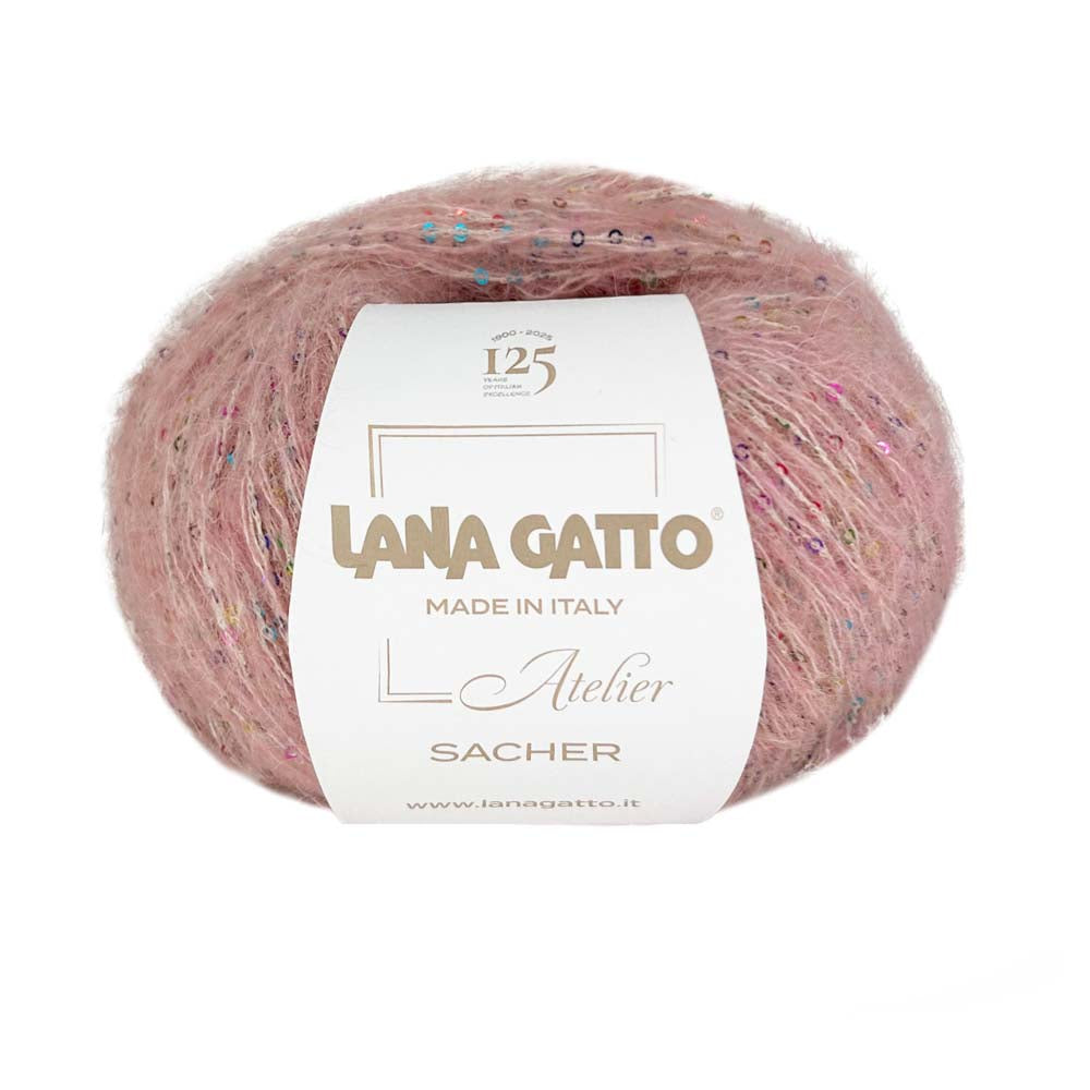 Ball of Lana Gatto Sacher yarn in pink with microsequins showing the mohair and alpaca blend halo