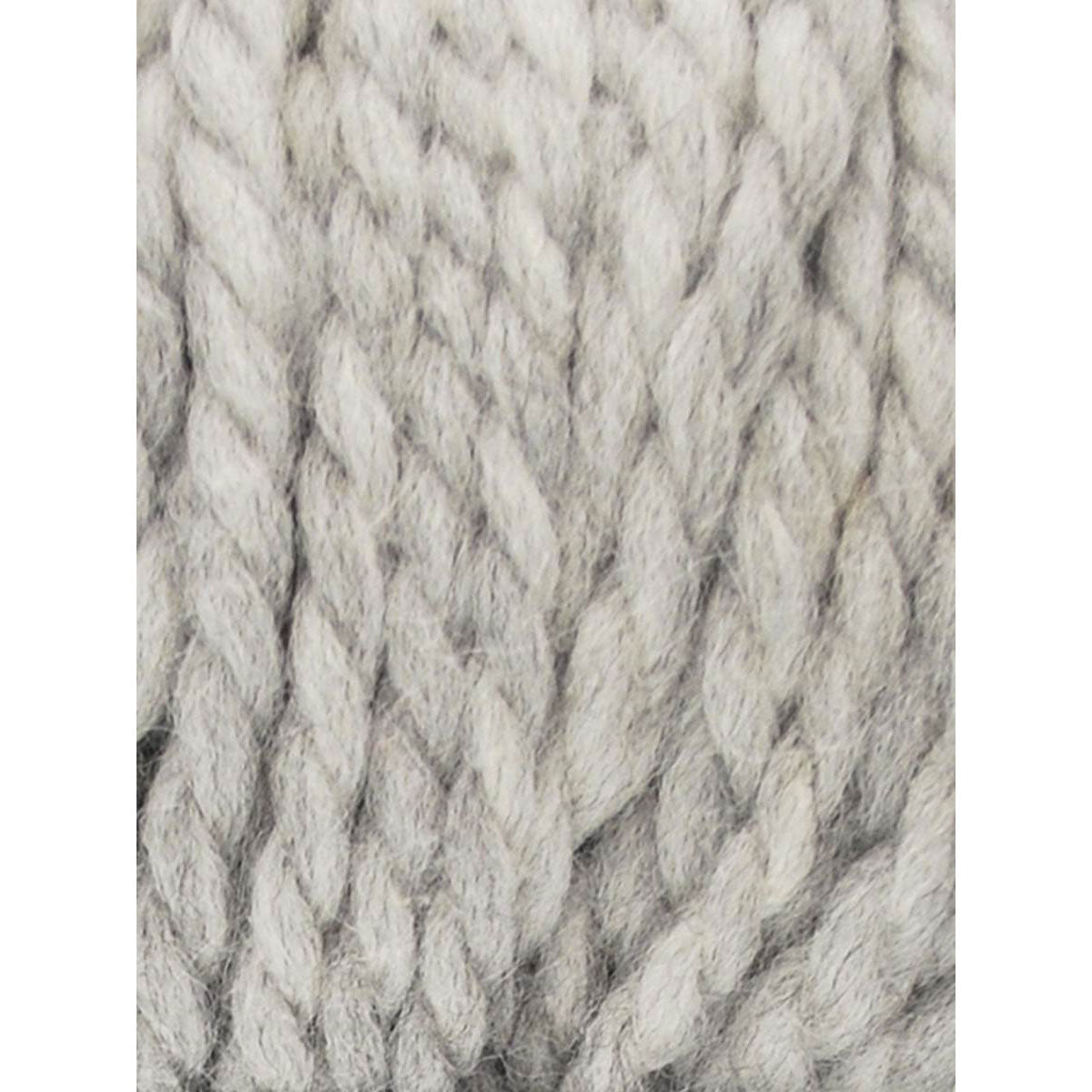 Close-up of pale gray textured yarn on a white background