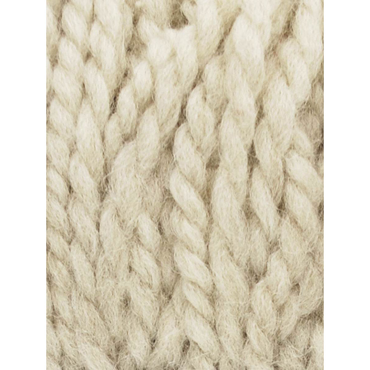 Close-up of creamy beige textrured yarn on a white background