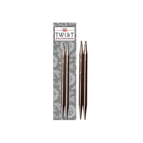 Pair of Twist stainless steel interchangeable knitting needle tips placed on packaging with pair of tips alongside