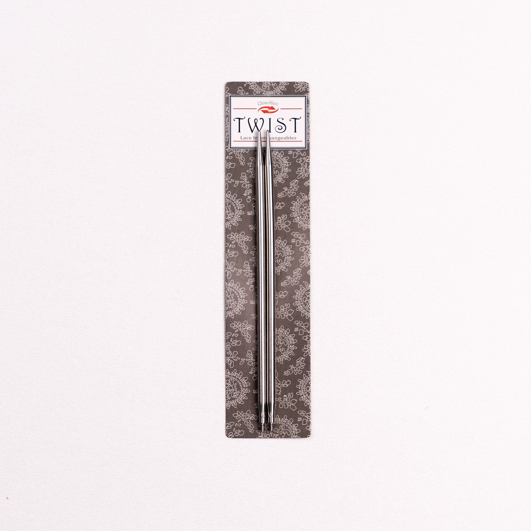 Pair of 5in long stainless steel interchangeable knitting tips on ChiaoGoo TWIST Lace Interchangeables product packaging 