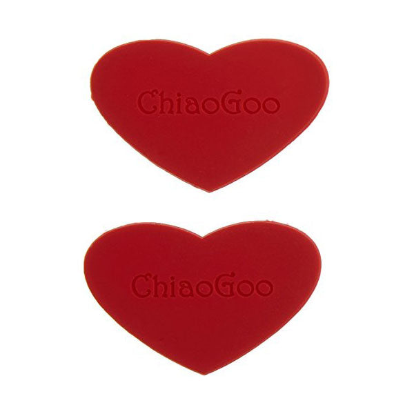 Two red heart-shaped ChiaoGoo rubber grippers on a white background