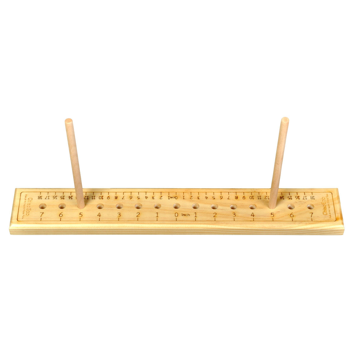 Piece of wood 2in x 16in with holes marked at paired intervals pair of dowels shown in position 5