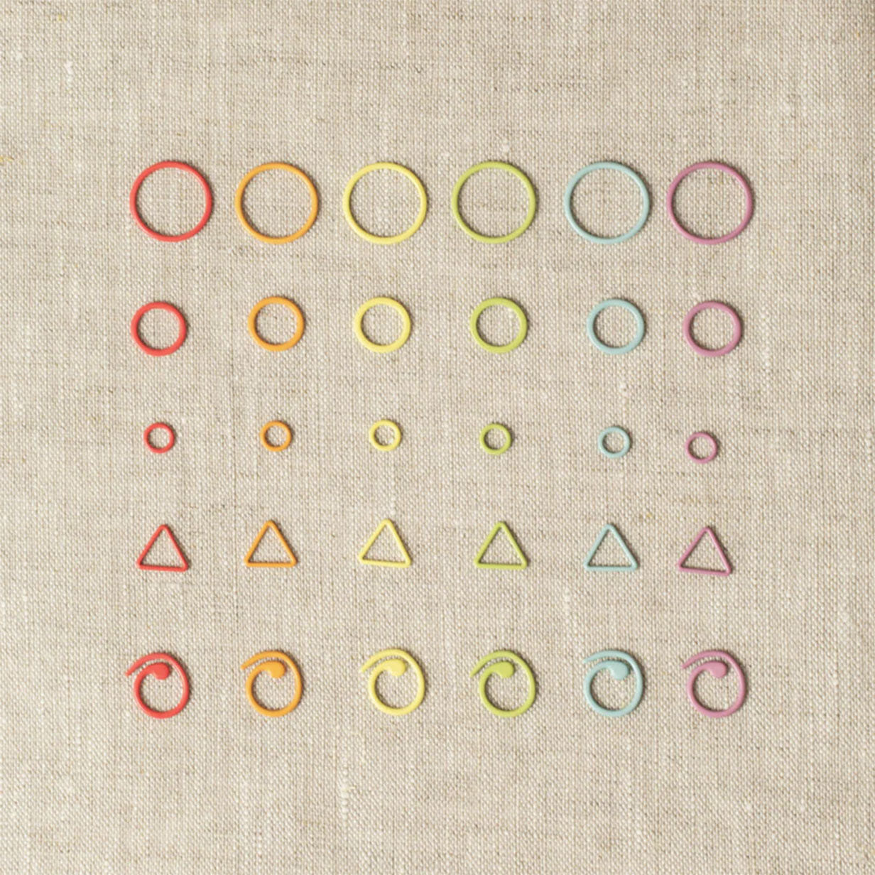Display of colourful stitch markers in six columns