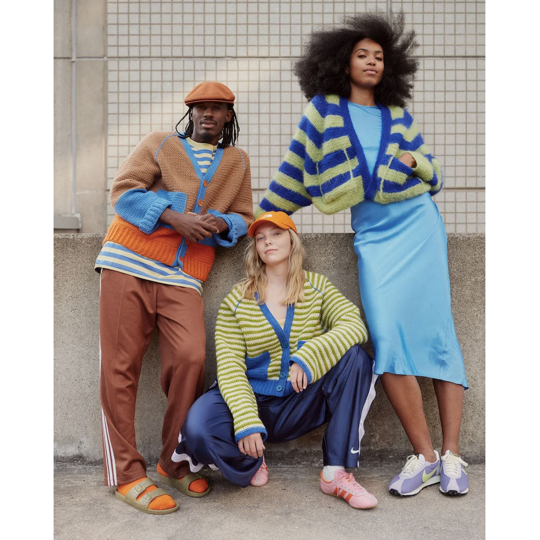Trio wearing colourful crochet jackets in urban setting
