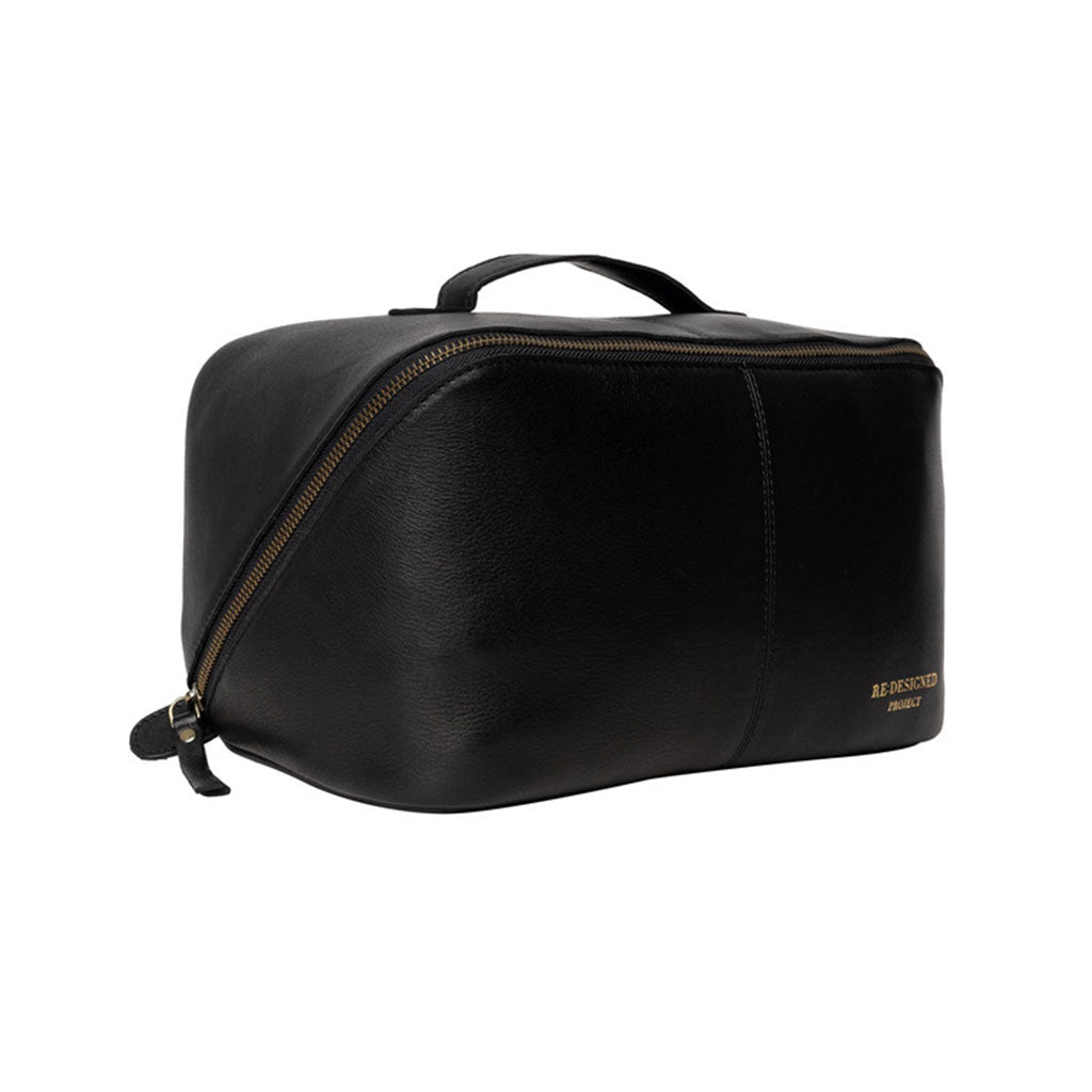 Black leather knitting project bag with brass coloured zipper on a white background