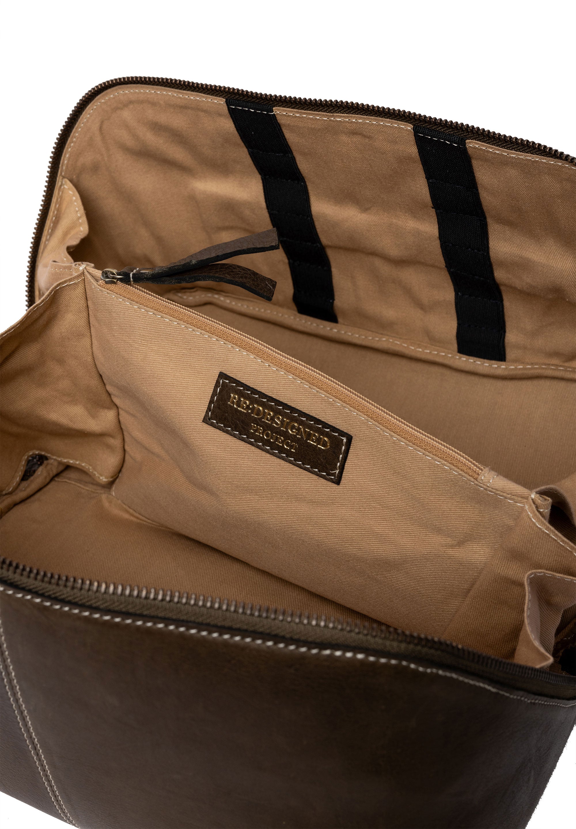 Open dark green leather knitting project bag showing ecru coloured cotton lining, on a white background