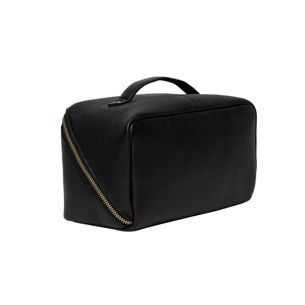 Back of black leather project bag with a gold zipper on a white background