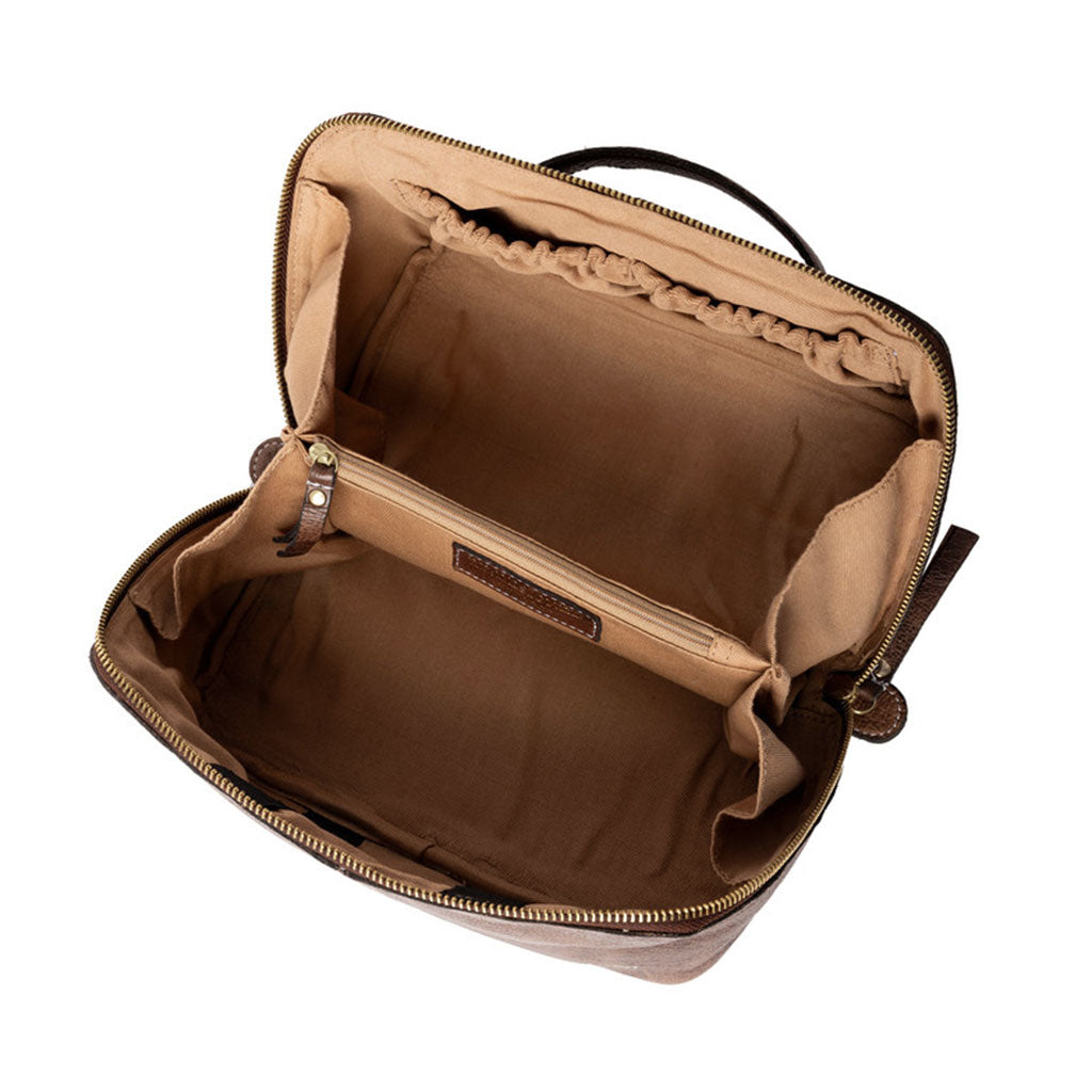 View of ecru coloured cotton interior lining of leather knitting project bag showing side panel pocket with elasticated top, central dividing section with zip closure