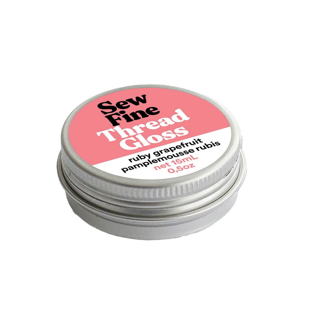 Sew Fine Thread Gloss - Ruby Grapefruit tin with coral label on a white background