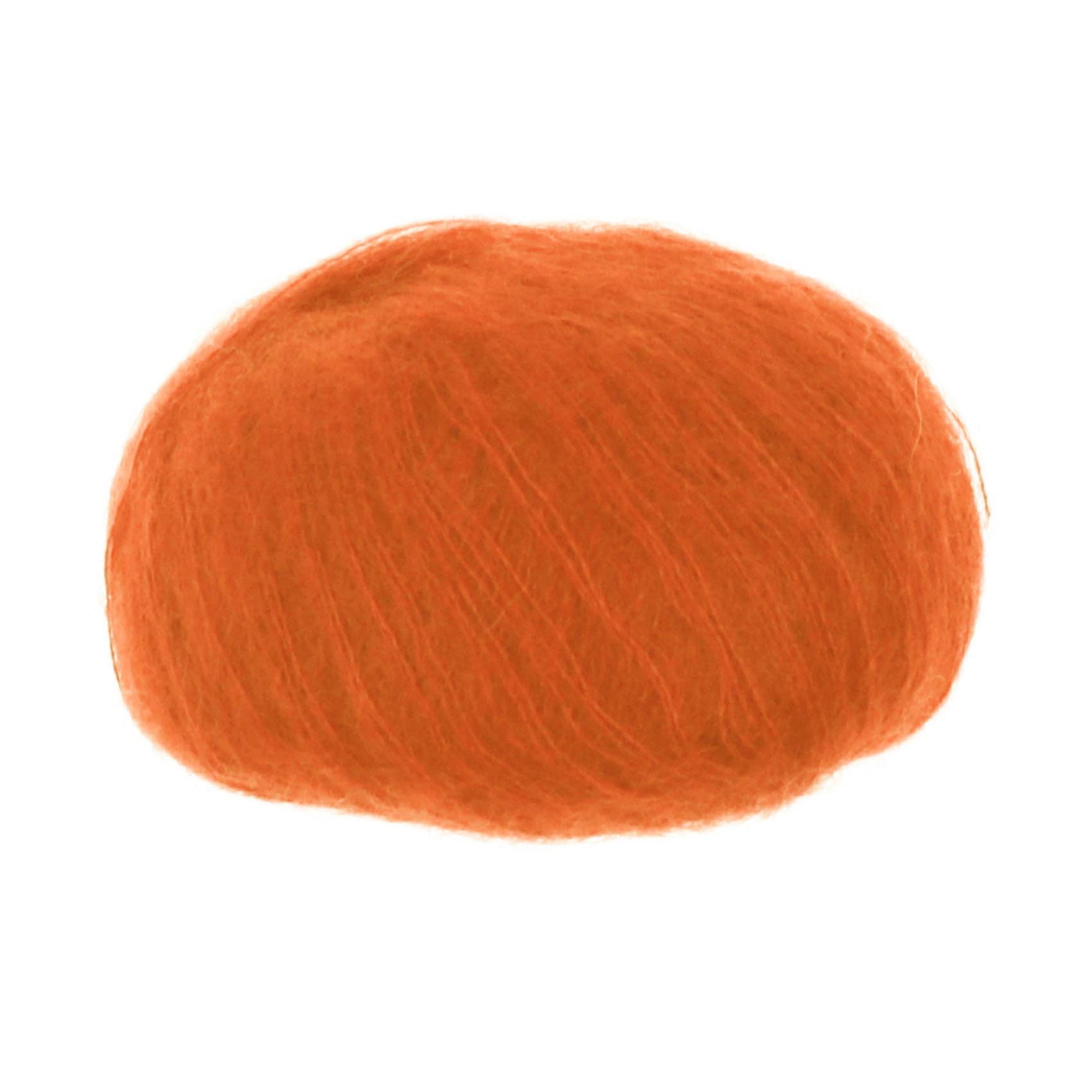 A ball of mohair and silk blend yarn in orange