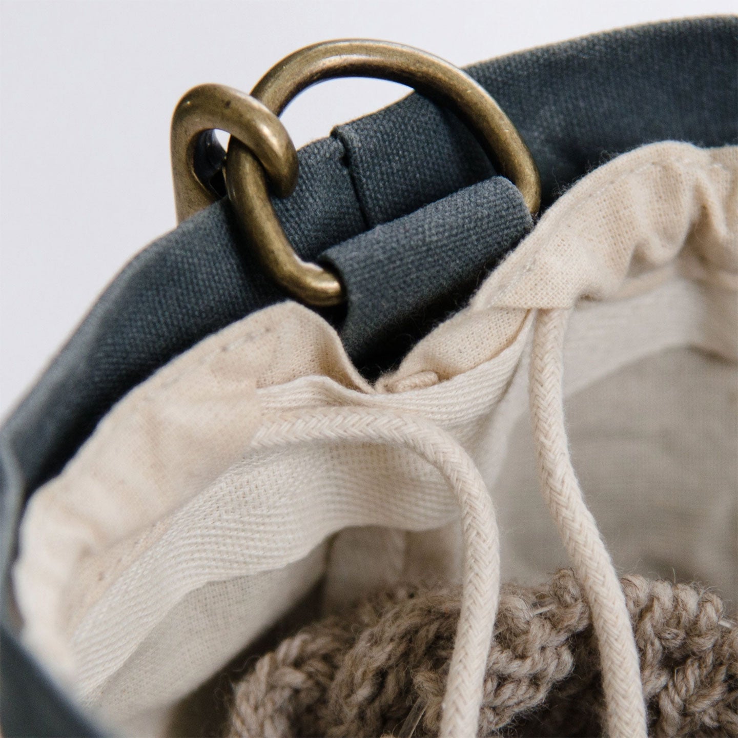 Close-up of the cotton lining with cotton drawstring inside the waxed canvas bucket bag