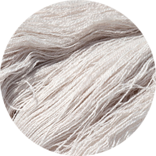 Close-up of beige yarn on a white background